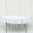 Round white tablecloth draped over a folding table.
