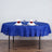 Round blue tablecloth with elegant table setting and decorative napkins.