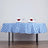 Table set with blue and white checkered tablecloth, elegant napkins, and glasses.