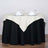 Elegant round table with cream tablecloth set for dining.