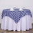 Round table set with blue and white checkered tablecloth and elegant glassware.