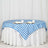 Blue and white checkered tablecloth draped over a round table