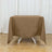 Brown tablecloth draped over a table in a studio setting.