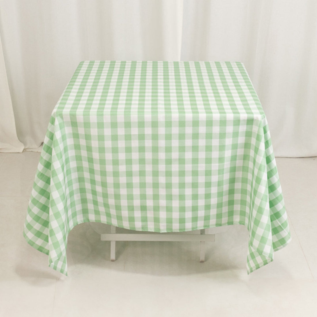Green and white checkered tablecloth on a table.