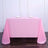 Pink tablecloth draped over a table, featuring a smooth texture and elegant look.