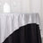 Shimmering silver and black tablecloth with elegant drape.