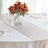 Elegant table setting with floral centerpiece and glassware.