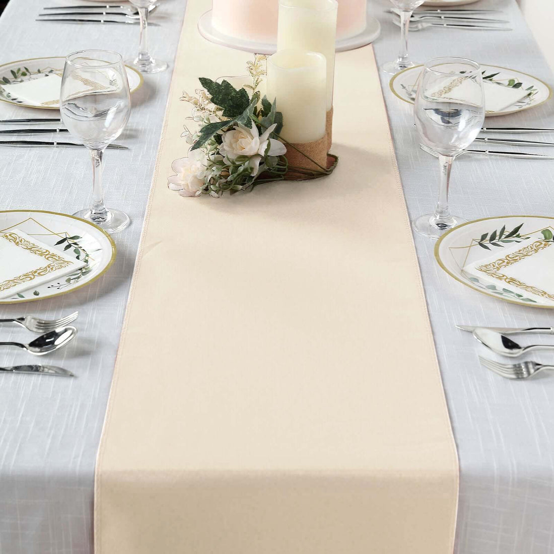 Elegant beige table runner on a dining table set for a formal meal.