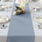 Elegant blue table runner on a beautifully set dining table.