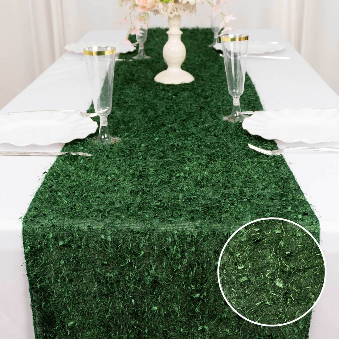 Green table runner with textured detail, perfect for elegant dining settings.