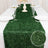 Green table runner with textured detail, perfect for elegant dining settings.