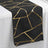 Black table runner with gold geometric pattern