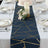 Elegant navy table runner with gold geometric design, styled for a dining table setting.