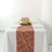 Elegant table setting with a geometric runner and white dinnerware.