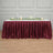 Maroon table skirt with gathered design, ideal for events and gatherings.