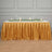 Elegant gold table skirt draping for events and celebrations.