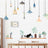 Decorative wall art with plants and lights in a cozy interior setting.