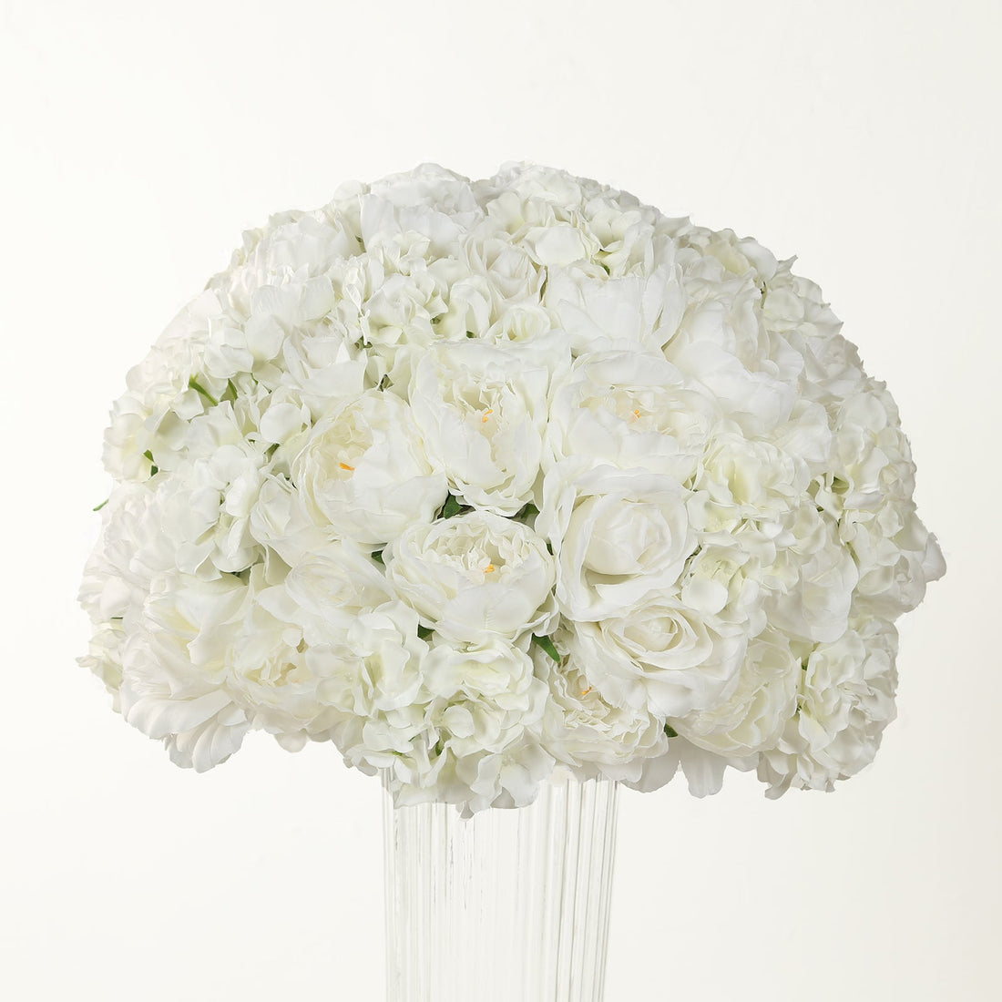 White floral arrangement in a clear vase.