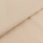 Beige textured fabric showcasing a smooth and ribbed surface.