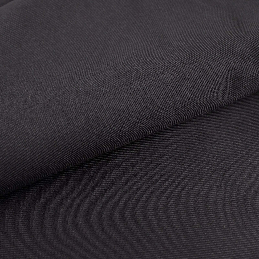 Black textured fabric showcasing fine ribbed details.