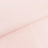 Light pink fabric with a smooth texture and folded edges.