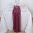 Burgundy table runner elegantly draped on a white table setting.