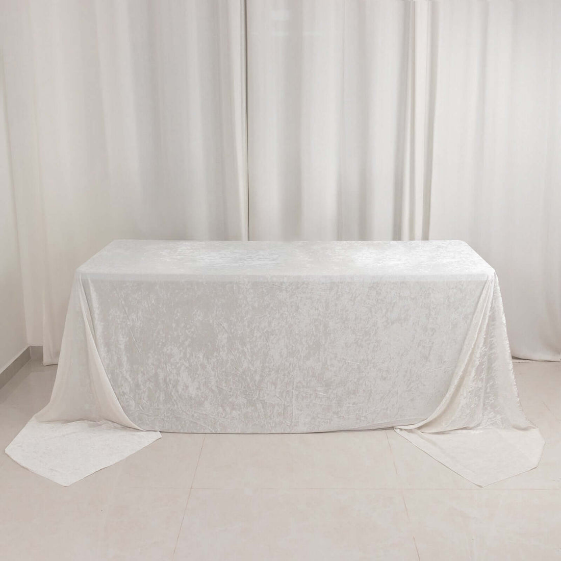 White textured tablecloth draped elegantly over a table