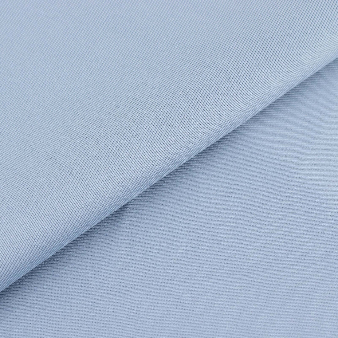 Light blue textured fabric with subtle diagonal stripes.