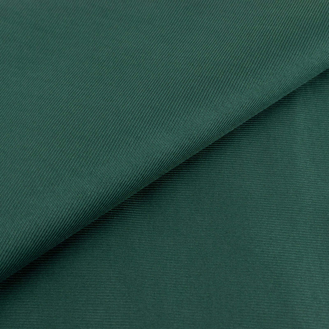 Green textured fabric with subtle ribbing detail.