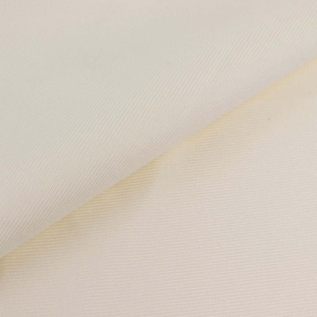 Textured cream fabric with fine ribbing detail.