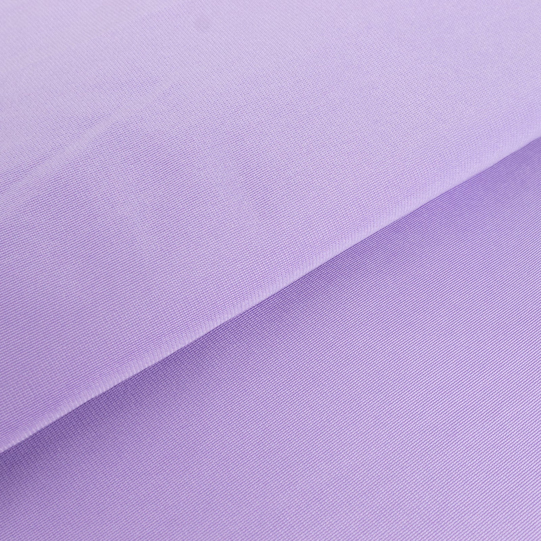 Purple fabric texture close-up showcasing soft, smooth surface details.