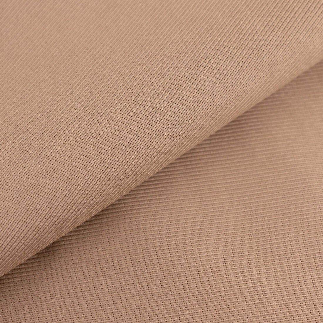 Textured beige fabric close-up showcasing soft, ribbed design.