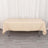 Beige table cover draped over a folding table.