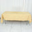 Yellow tablecloth draped over a rectangular table in a studio setting