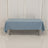 Blue tablecloth on a table in a studio setting.