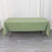 Green tablecloth draped over a table on a plain background.