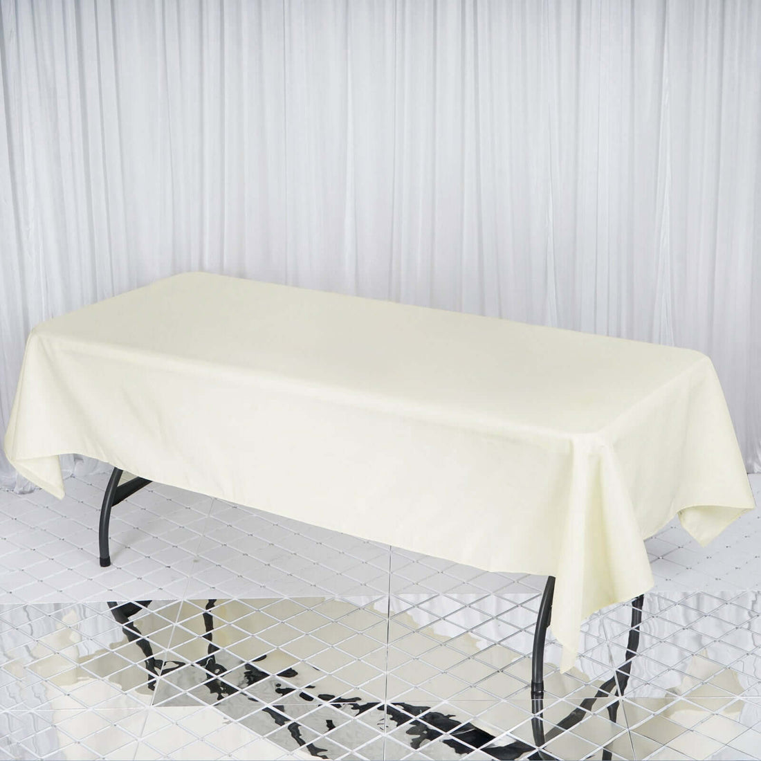 Cream tablecloth draped over a rectangular table