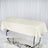 Cream tablecloth draped over a rectangular table