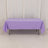 Purple tablecloth draped over a rectangular table in a studio setting.