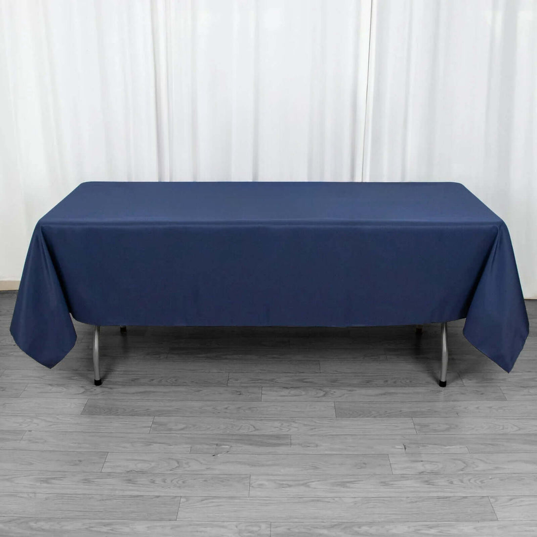 Navy blue tablecloth draped over a folding table