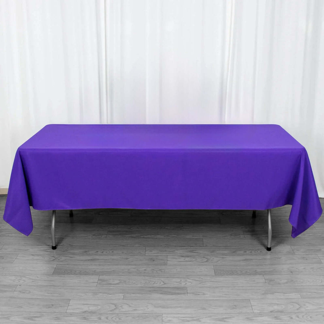 Purple tablecloth draped over a rectangular table