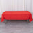 Red tablecloth on a table in a studio setting.