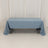 Blue tablecloth draped over a table in a studio setting.