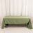 Green tablecloth on a table in a studio setting.