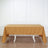 Brown tablecloth draped over a white table in a studio setting.