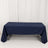 Navy tablecloth draped over a rectangular table in a studio setting