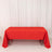 Red tablecloth draped over a table in a studio setting.