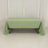 Green tablecloth draped over a table in a studio setting.