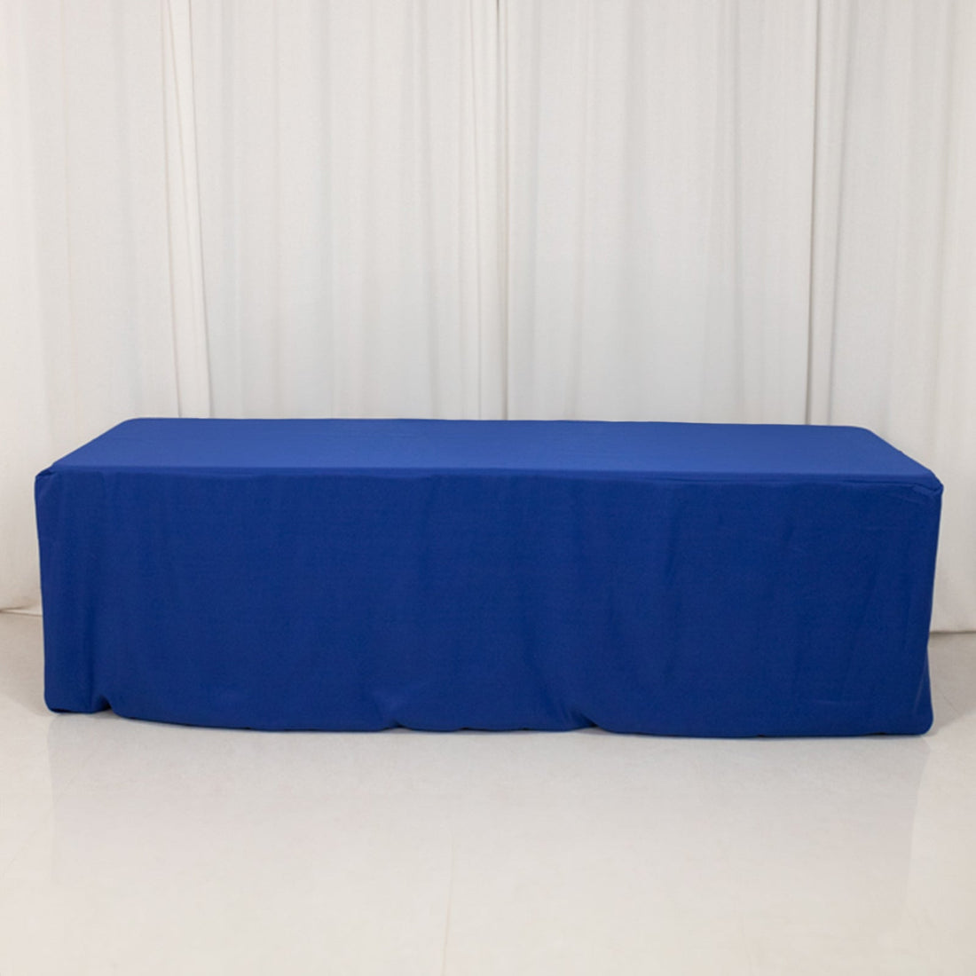 Blue table cover on a plain backdrop