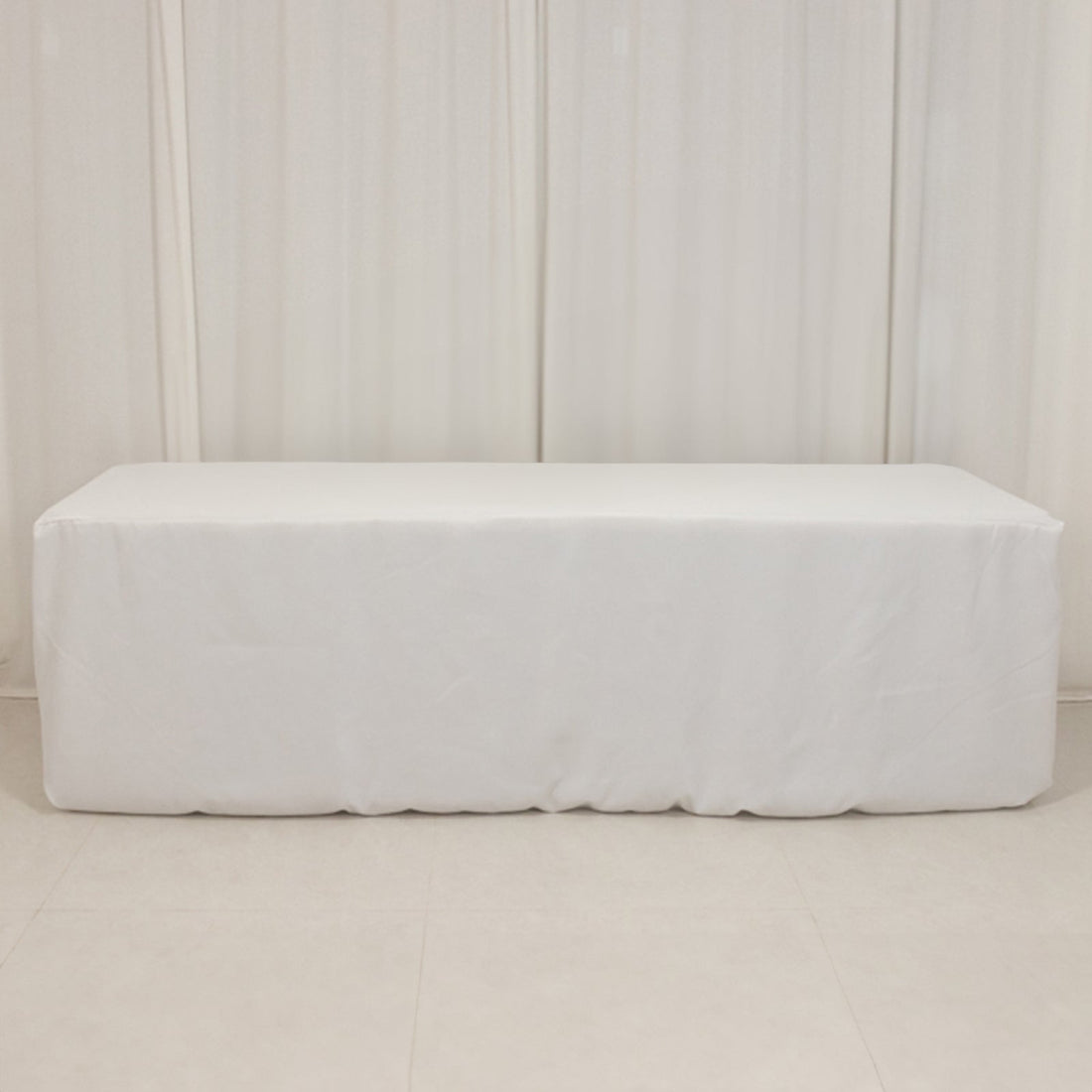 White table cover for events and gatherings, providing a clean and elegant look.